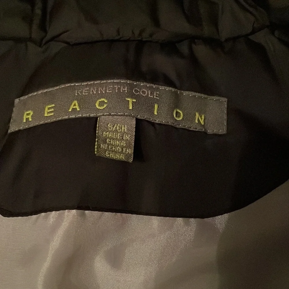 Kenneth Cole reaction black puffer white marks can be removed with eraser
